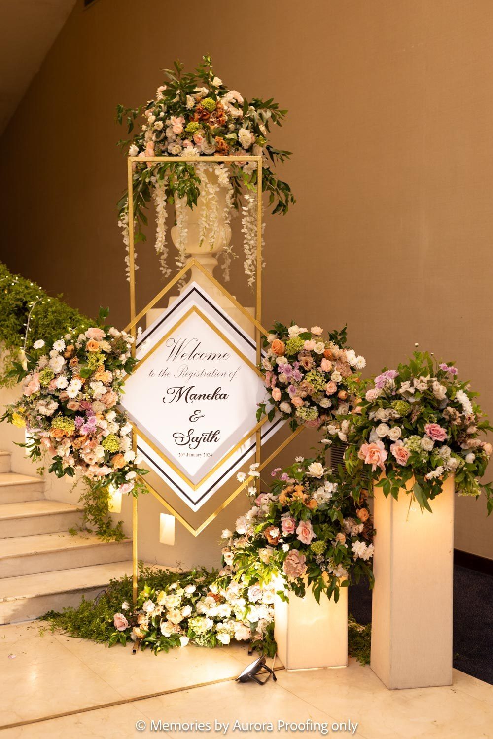 Welcome sign framed with blush and ivory florals
