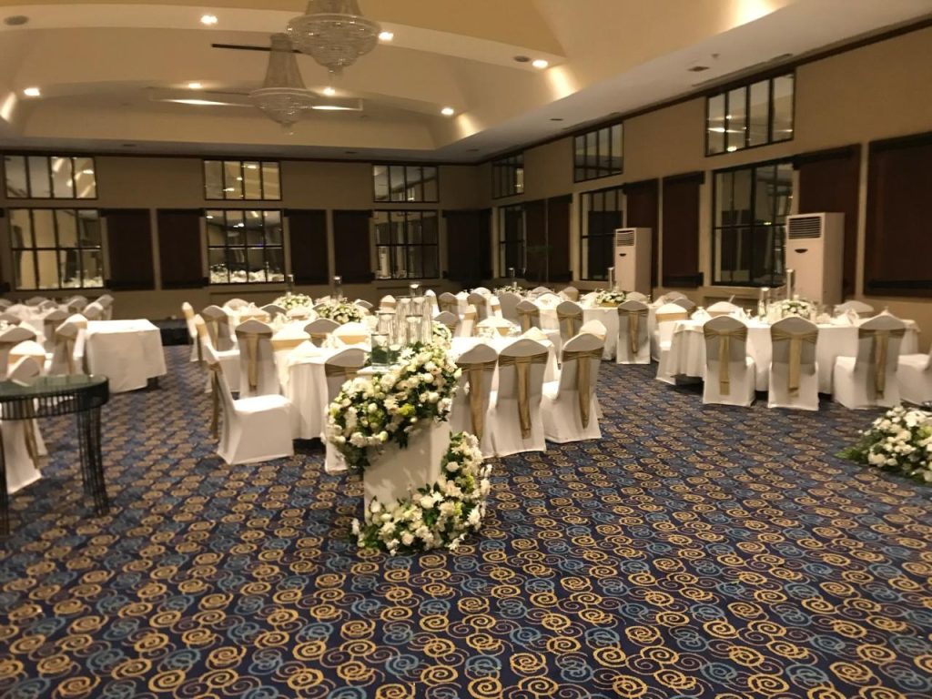 Reception hall with floral table arrangements