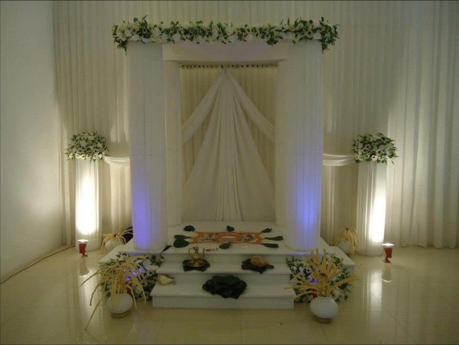 White draped poruwa with floral canopy