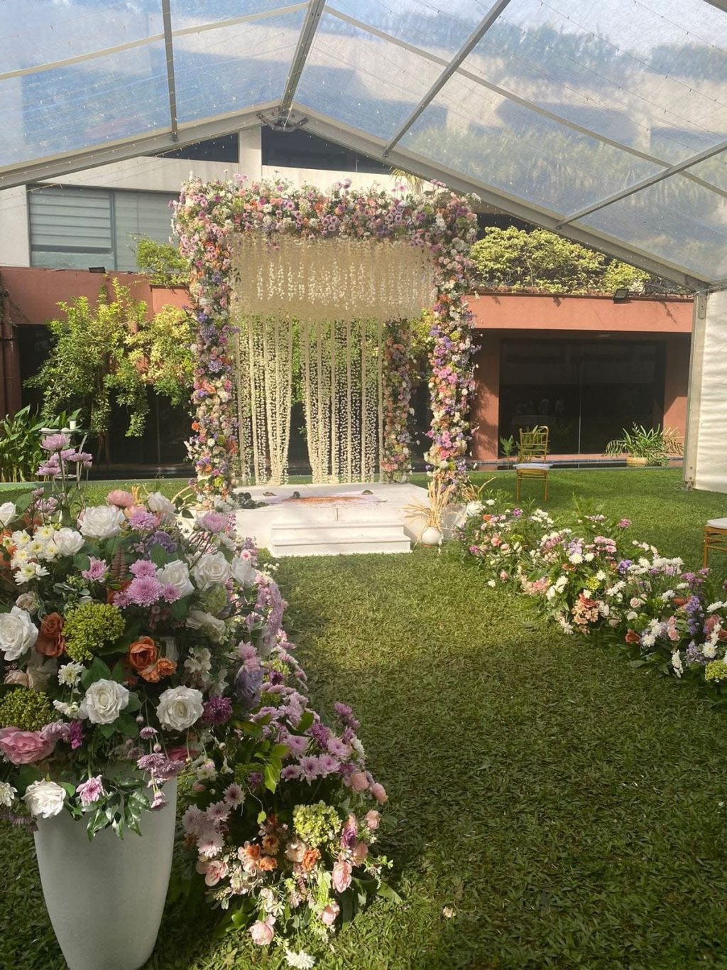 Garden entrance arch with pastel flowers